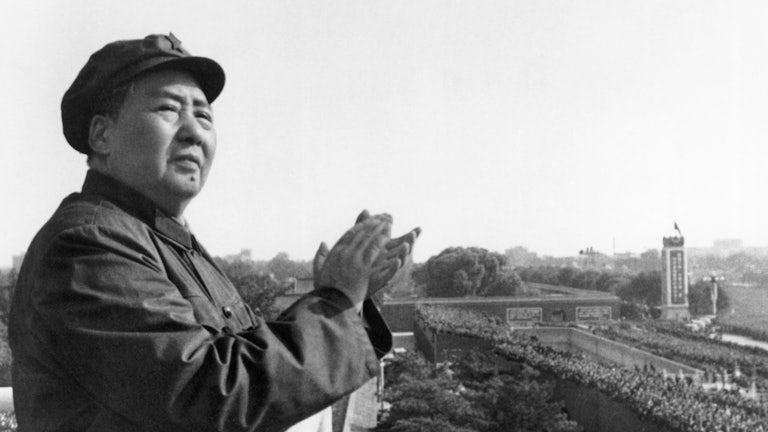 Mao Zedong claps from a balcony