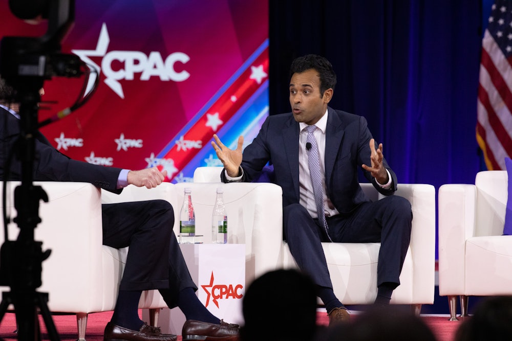 Vivek Ramaswamy speaks while seated onstage.