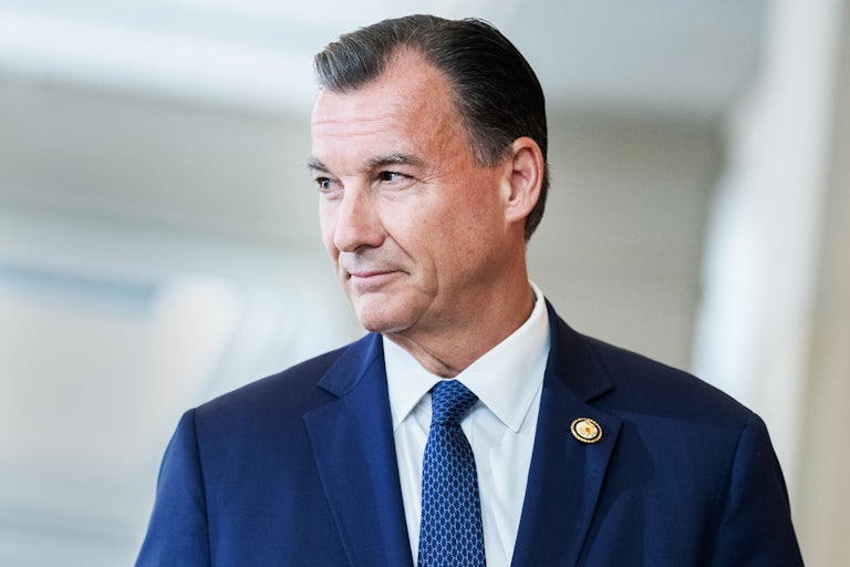 Representative Tom Suozzi looks to the side