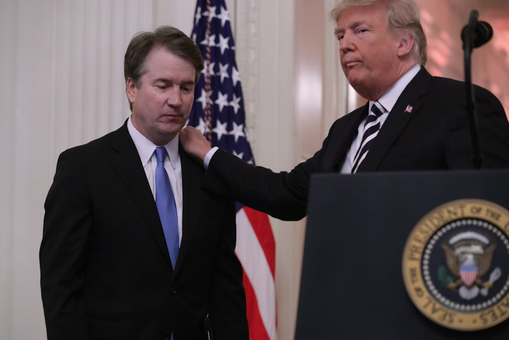 President Donald Trump puts his hand on Supreme Court Justice Brett Kavanaugh's shoulder during his ceremonial swearing in on October 08, 2018 in Washington, DC.
