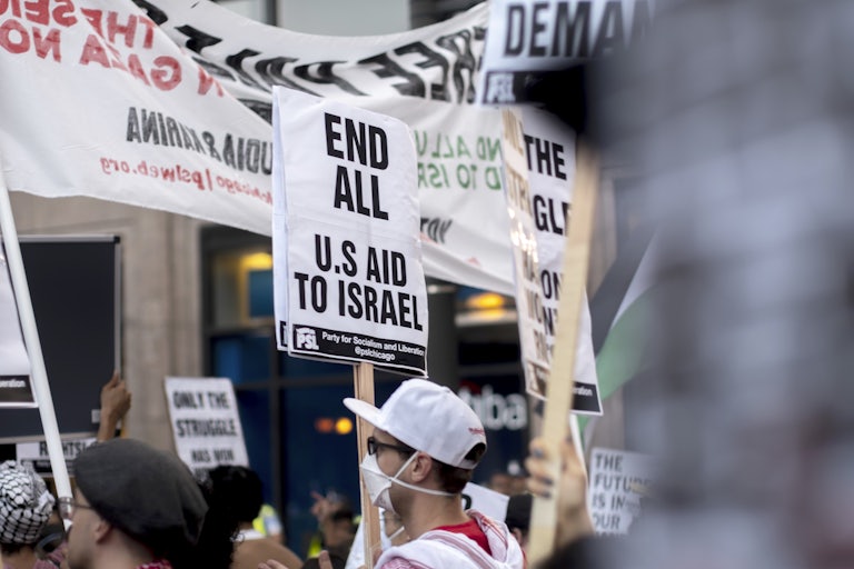 Protesters march in support of Palestine outside the DNC in Chicago