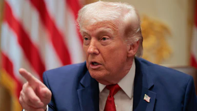 President Donald Trump points while speaking