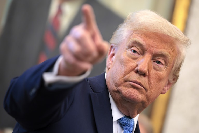 Donald Trump points during a press conference in the Oval Office