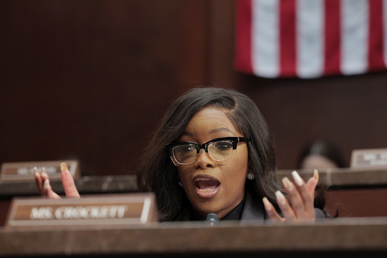Representative Jasmine Crockett gestures while speaking during a House hearing
