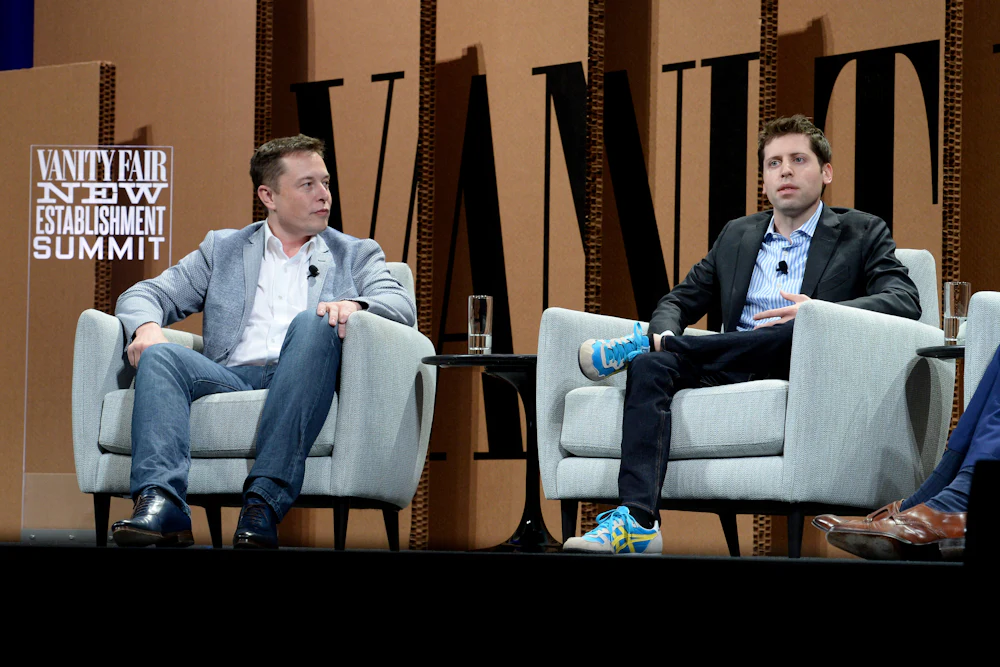 Elon Musk and Sam Altman sit next to each other onstage during a Vanity Fair summit in San Francisco in 2015.