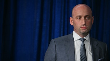 Deputy White House Chief of Staff Stephen Miller stands during a Donald Trump speech