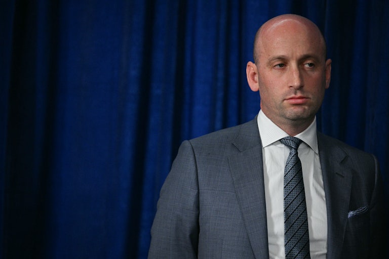 Deputy White House Chief of Staff Stephen Miller stands during a Donald Trump speech