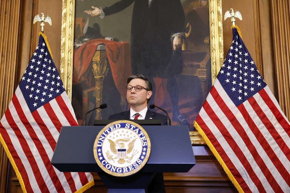 Mike Johnson speaks at a lectern.