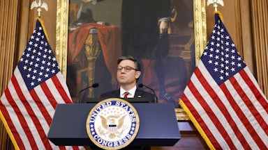 Mike Johnson speaks at a lectern.