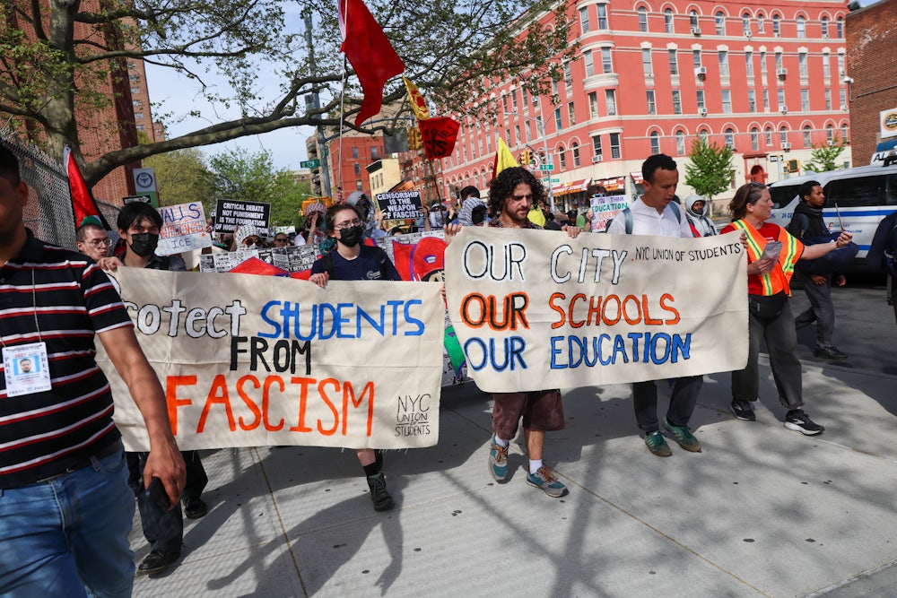 Protesters march through Manhattan carrying signs reading "Protect Students From Fascism" and "Our City Our Schools Our Education"