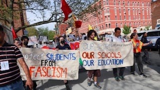 Protesters march through Manhattan carrying signs reading "Protect Students From Fascism" and "Our City Our Schools Our Education"