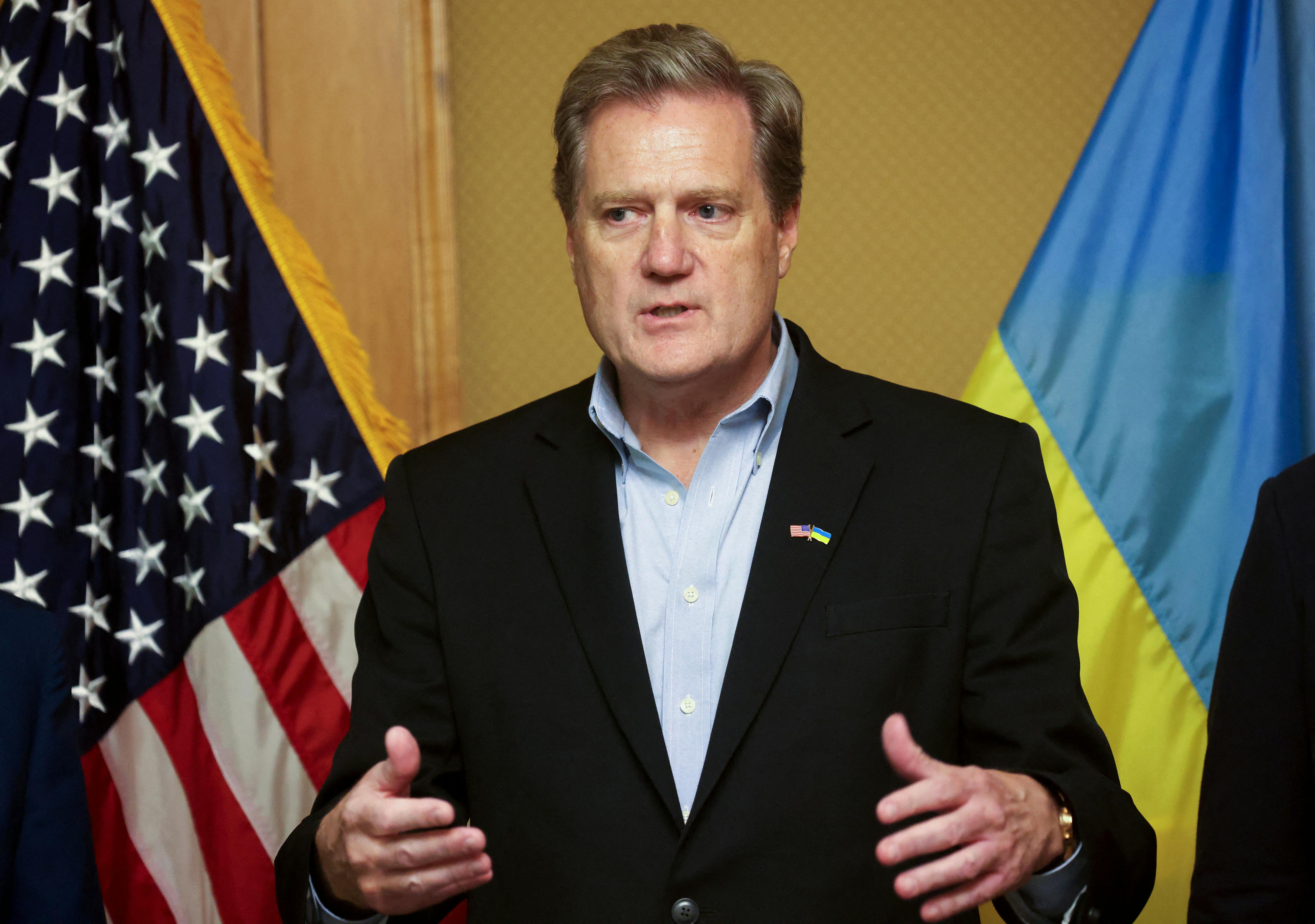 Representative Mike Turner gestures while speaking