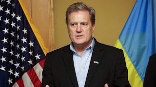 Representative Mike Turner gestures while speaking