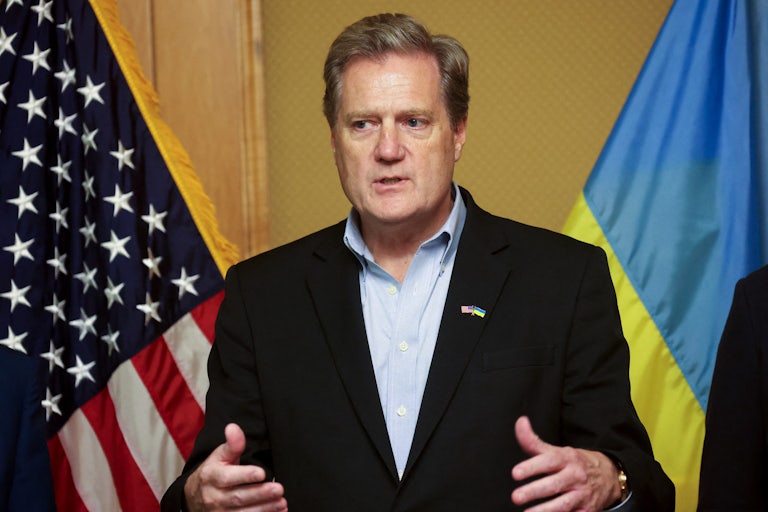 Representative Mike Turner gestures while speaking