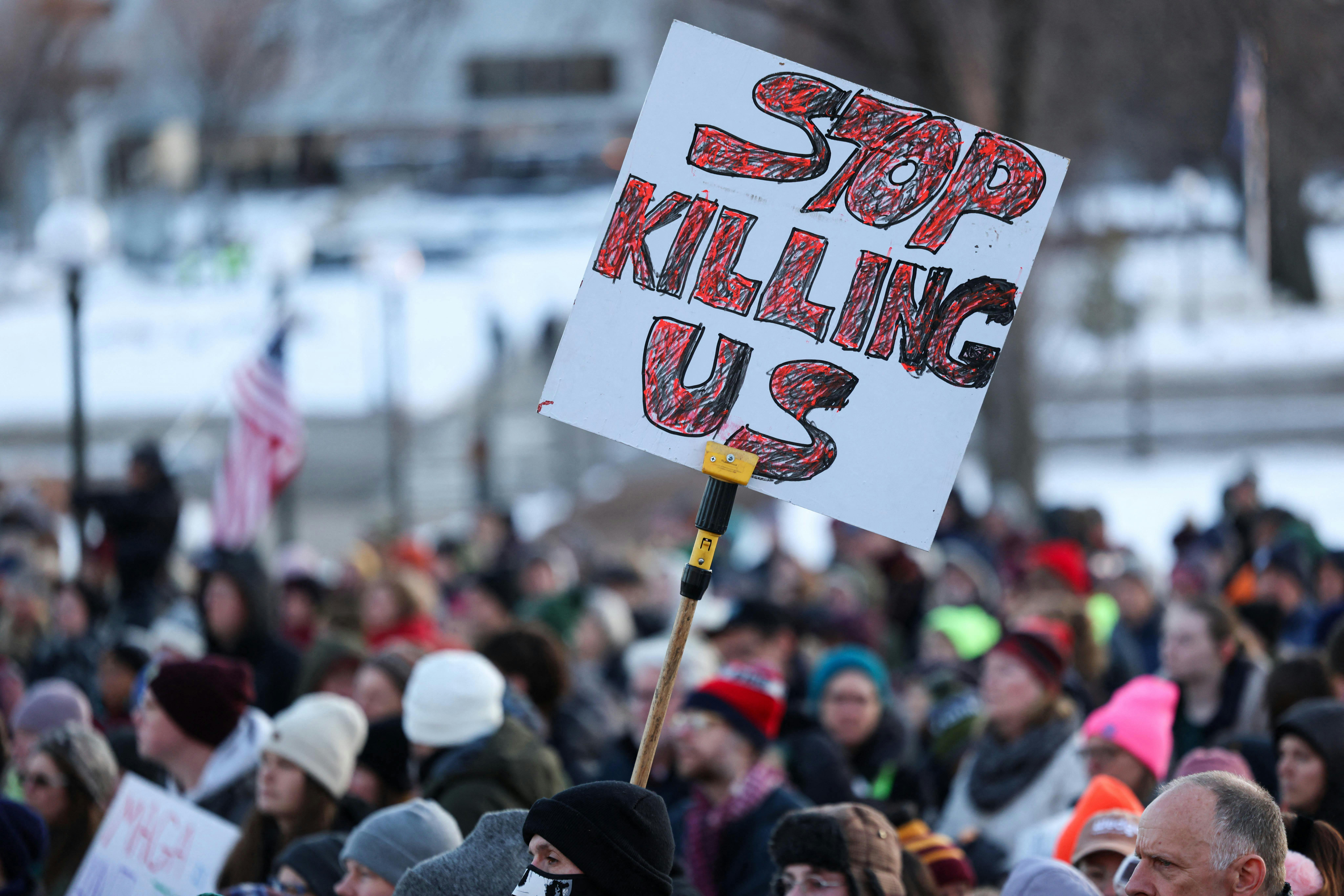 People gather in front of the Minnesota State Capitol during a demonstration over the fatal shooting of Renee Good.