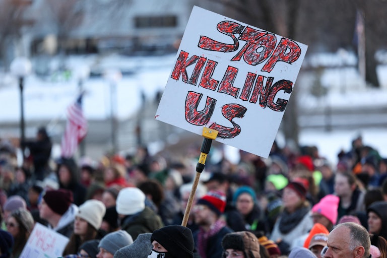 People gather in front of the Minnesota State Capitol during a demonstration over the fatal shooting of Renee Good.