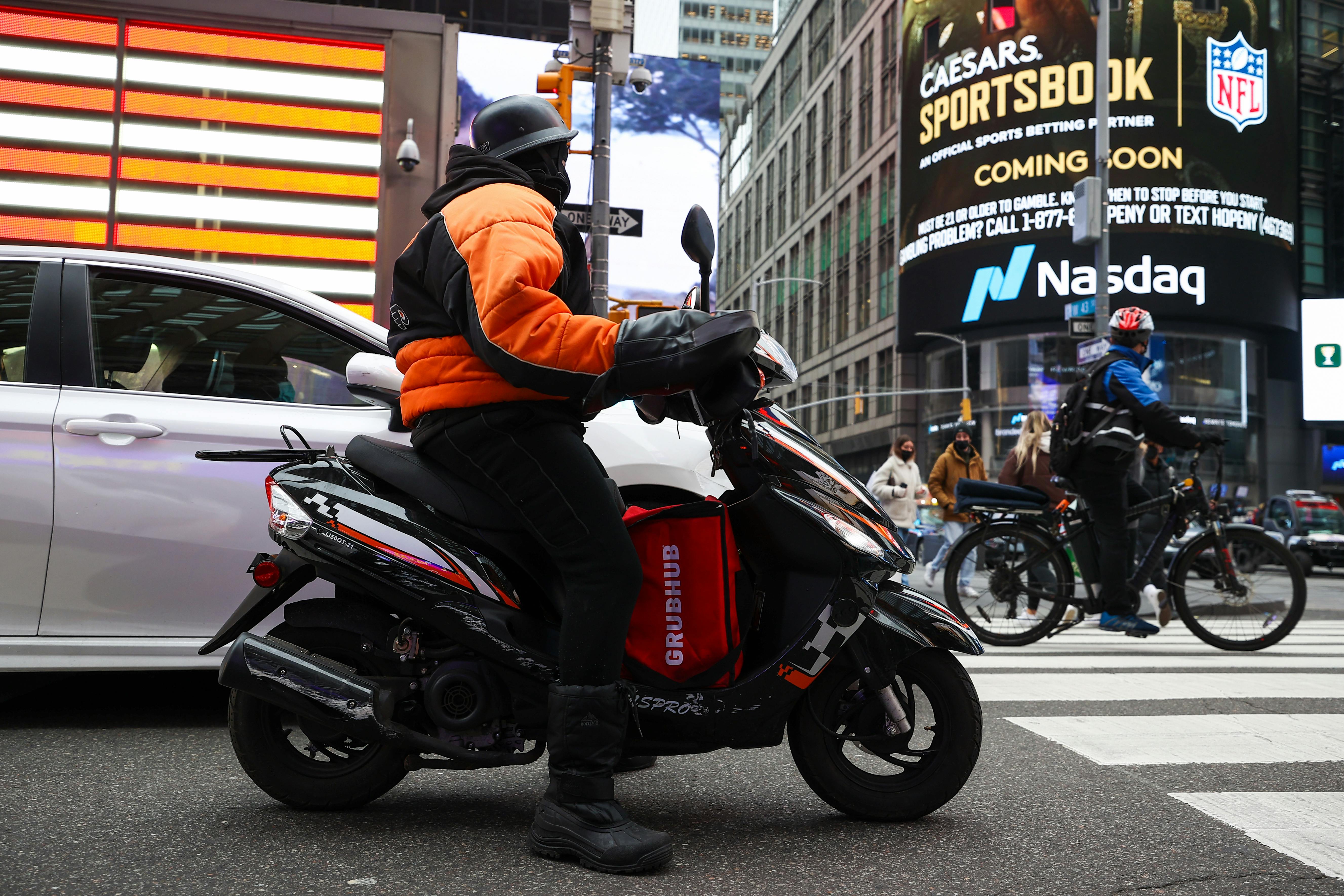 A Grubhub delivery worker in Times Square in New York City.