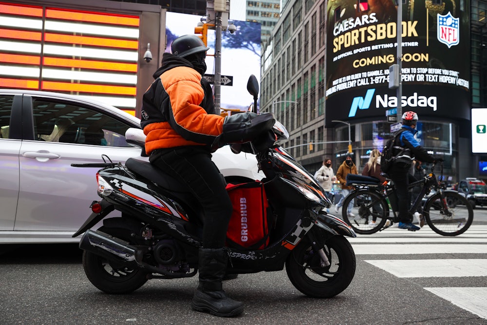 A Grubhub delivery worker in Times Square in New York City.