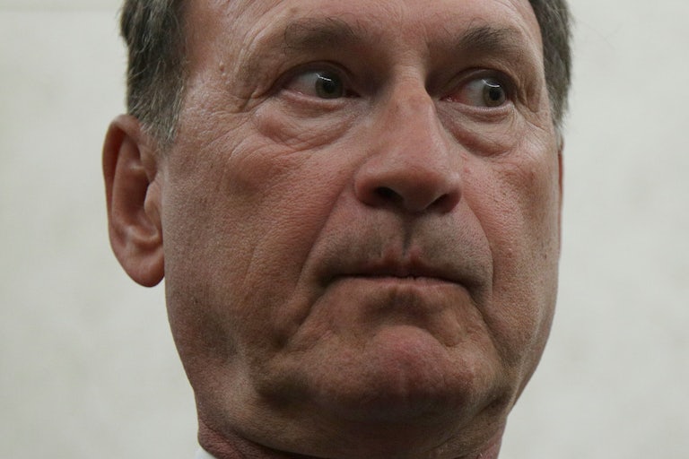 Supreme Court Justice Samuel Alito purses his lips