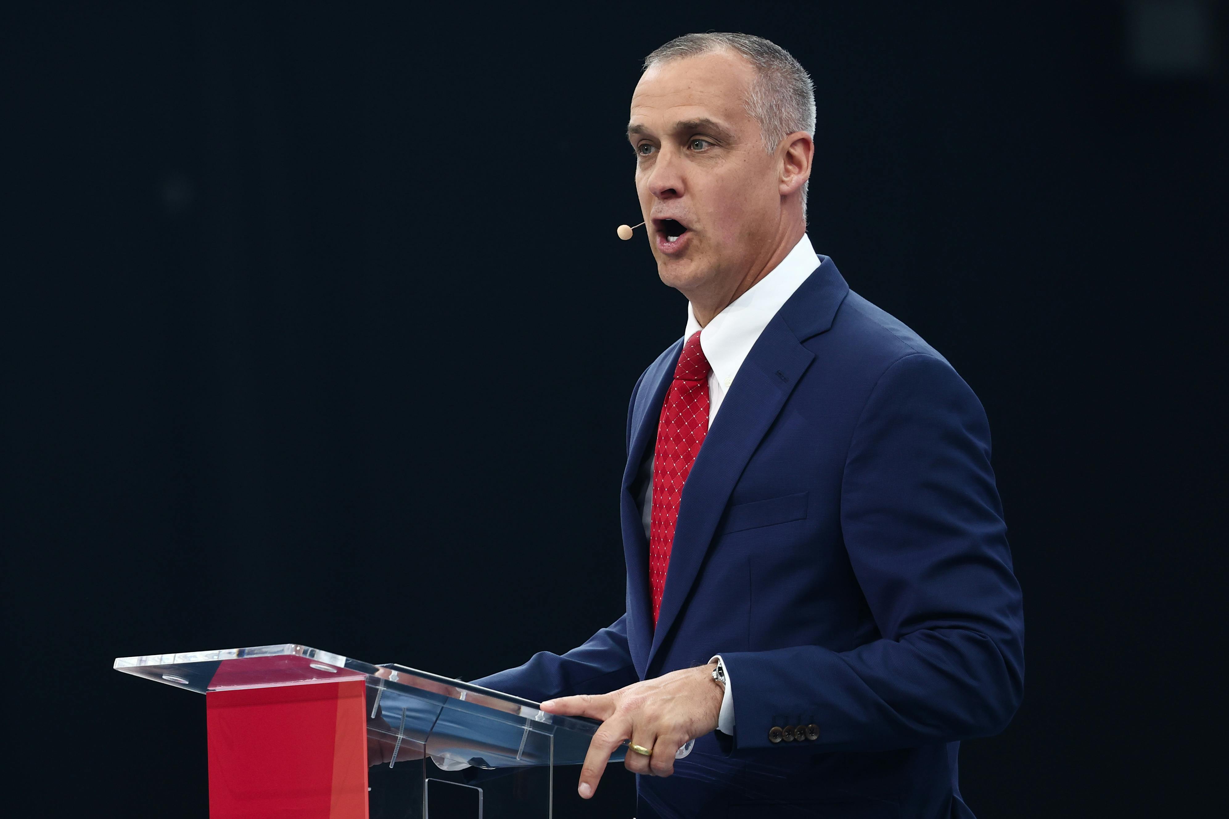 Corey Lewandowski speaks at a podium
