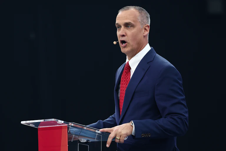 Corey Lewandowski speaks at a podium