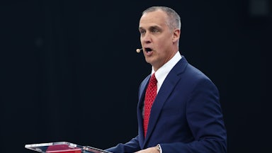 Corey Lewandowski speaks at a podium