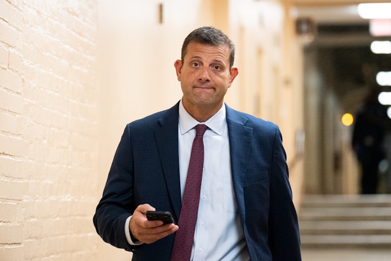 Rep. David Valdeo stares ahead as he walks in the Capitol