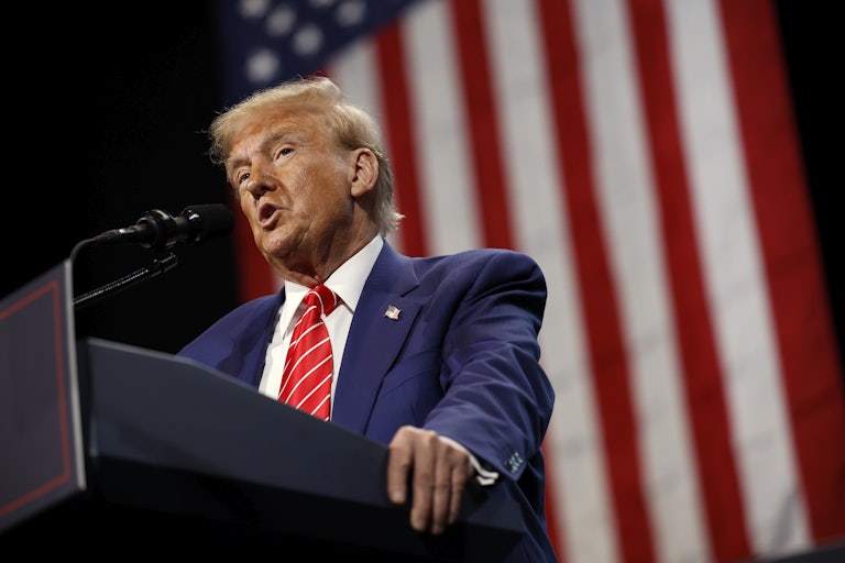 Donald Trump speaks at a podium