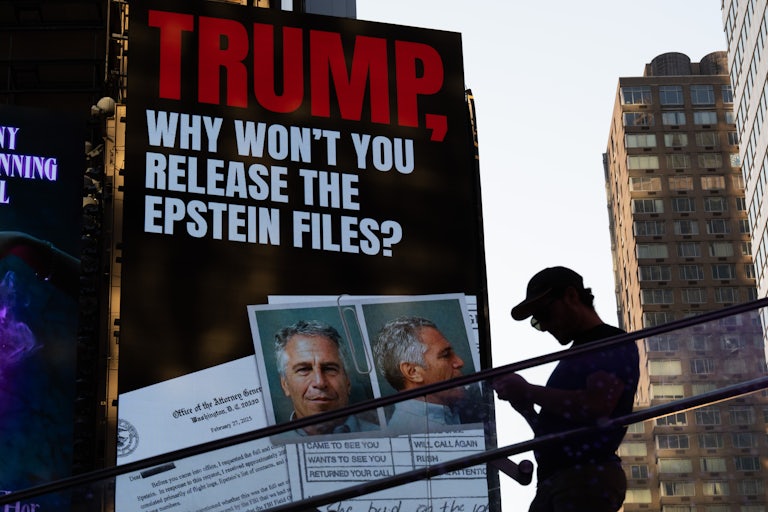 A billboard in Times Square says, "Trump, why won't you release the Epstein files?" and shows a picture of Justice Department documents on Jeffrey Epstein