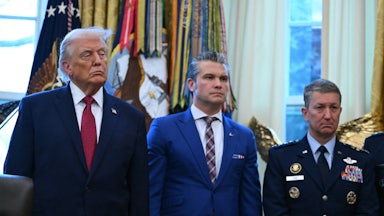 Doanld Trump, Pete Hegseth, and Joint Chiefs of Staff Gen. Dan Caine stand side by side in the Oval Office of the White House.