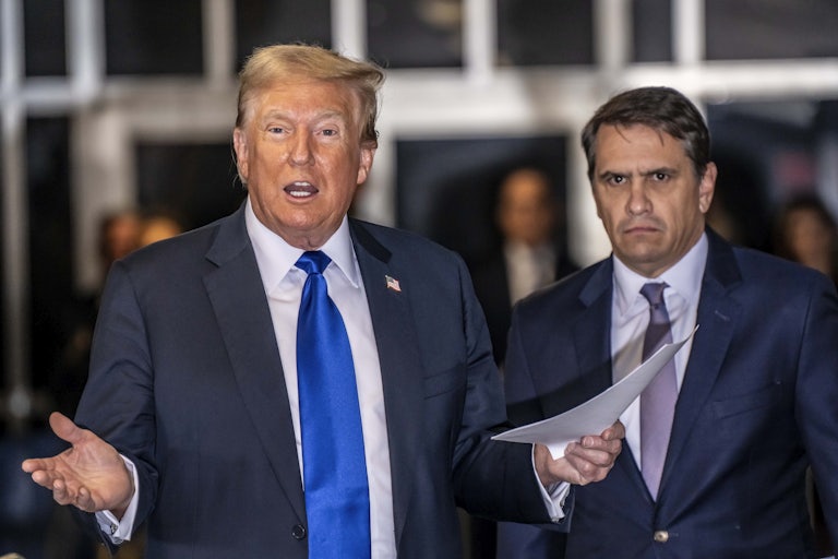 Donald Trump speaks as Todd Blanche stands next to him