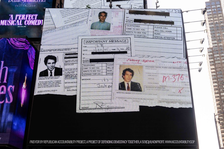 A billboard in Times Square shows random documents with Jeffrey Epstein's face.