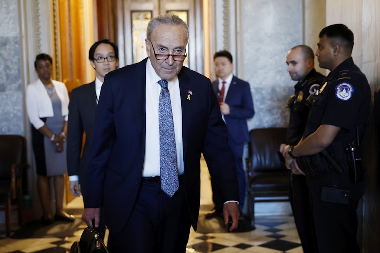 Senate Majority Leader Chuck Schumer walks in the Capitol
