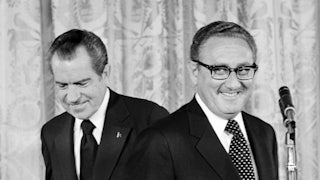 President Nixon (L) congratulates newly appointed Secretary of State Henry Kissinger