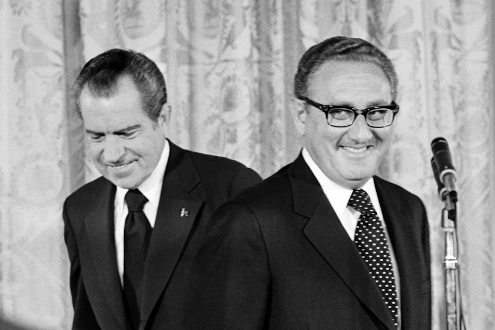 President Nixon (L) congratulates newly appointed Secretary of State Henry Kissinger