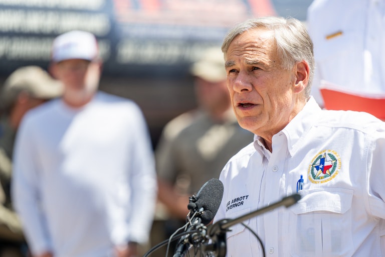 Texas Governor Greg Abbott speaks at a mic.