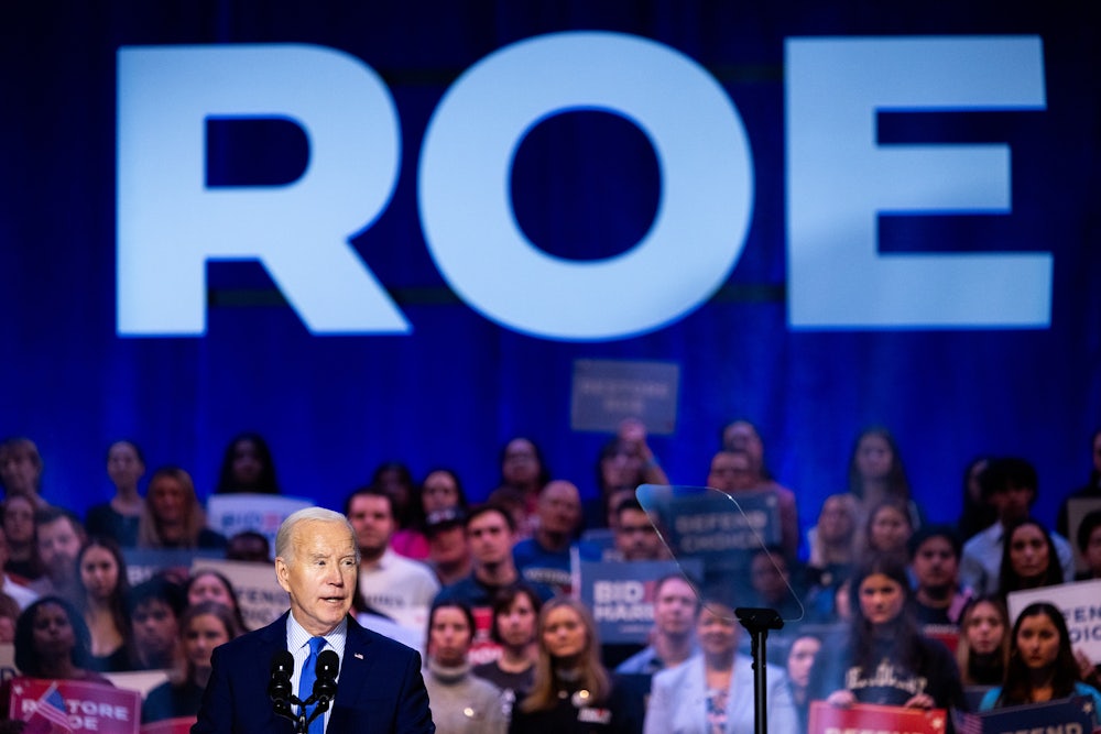 A Biden campaign rally with a big "Roe" sign