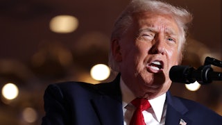 Donald Trump speaks into a mic