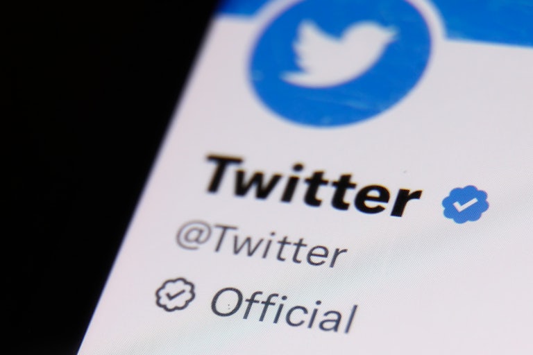 Twitter account on Twitter is seen displayed on a phone screen