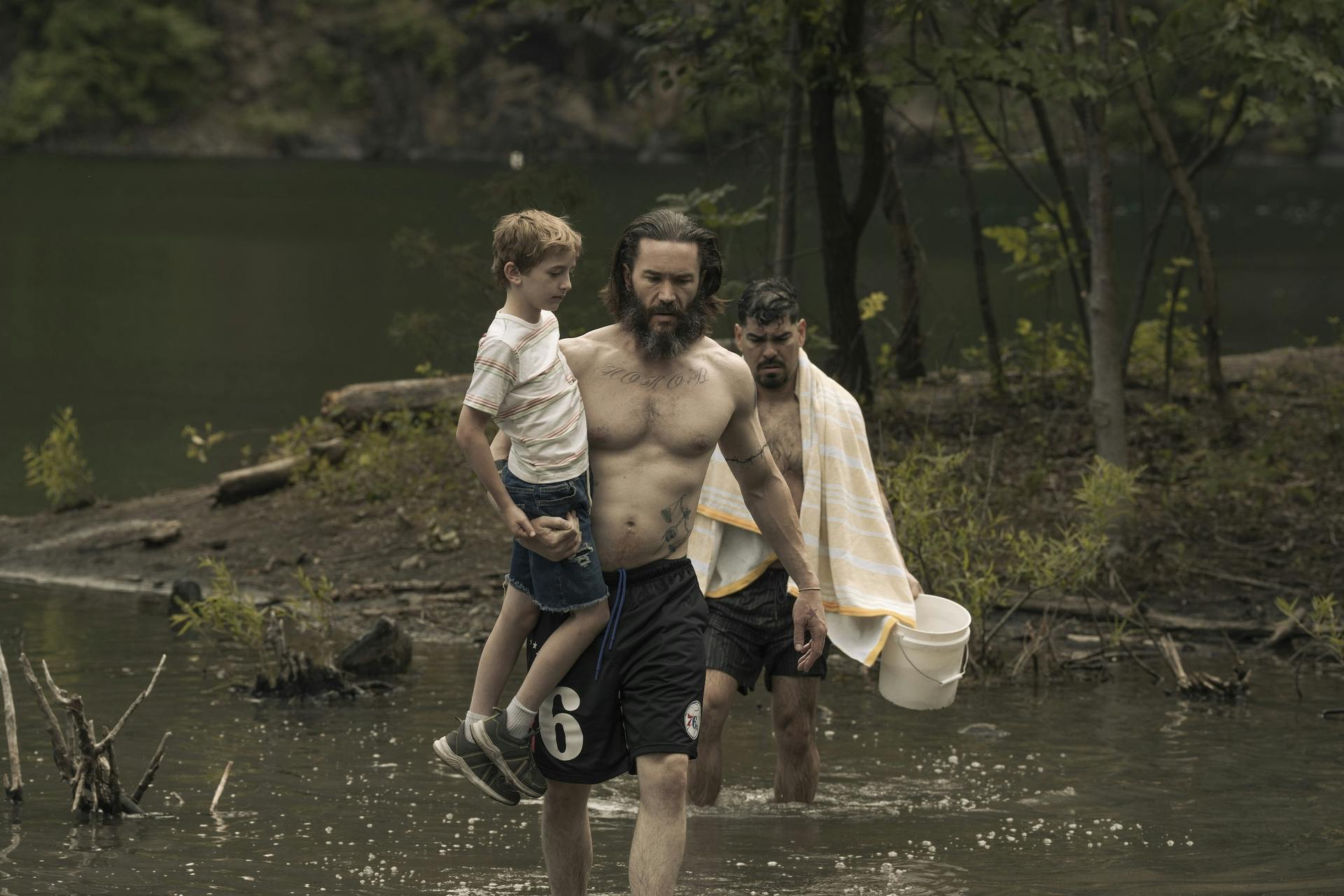 Tom Pelphrey, Ben Doherty and Raúl Castillo wade across a river in “Task”