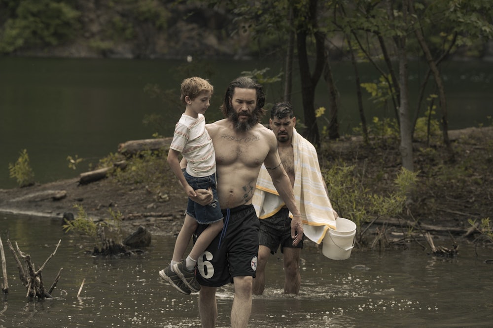 Tom Pelphrey, Ben Doherty and Raúl Castillo wade across a river in “Task”