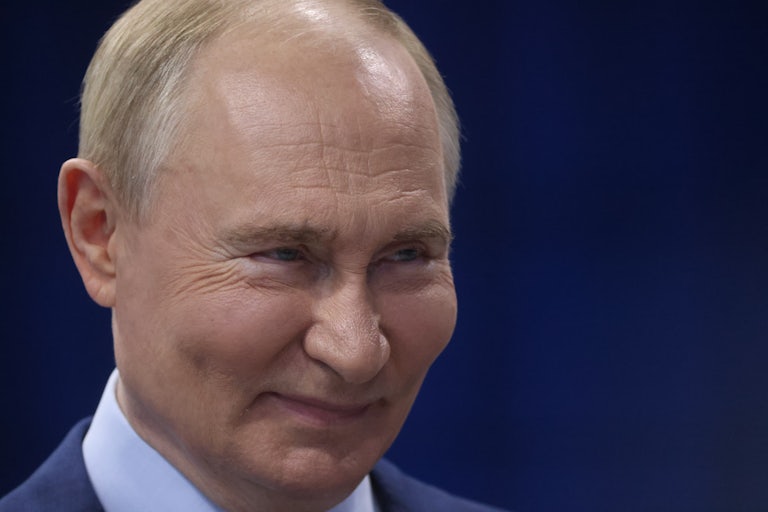 Vladimir Putin smiles