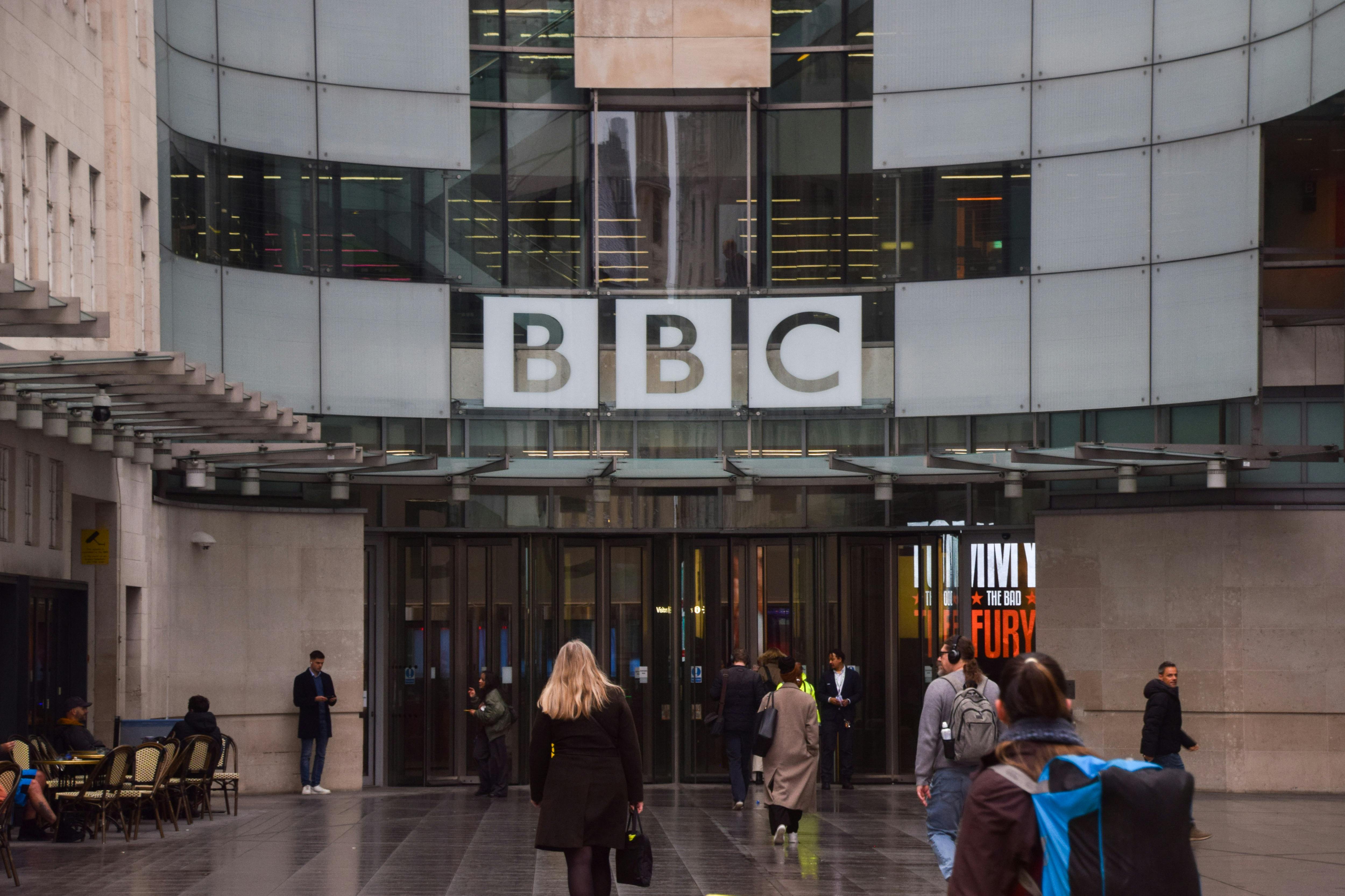 People walk outside the BBC headquarters in London.