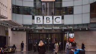 People walk outside the BBC headquarters in London.