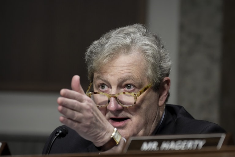 Senator John Kennedy points his hand straight ahead