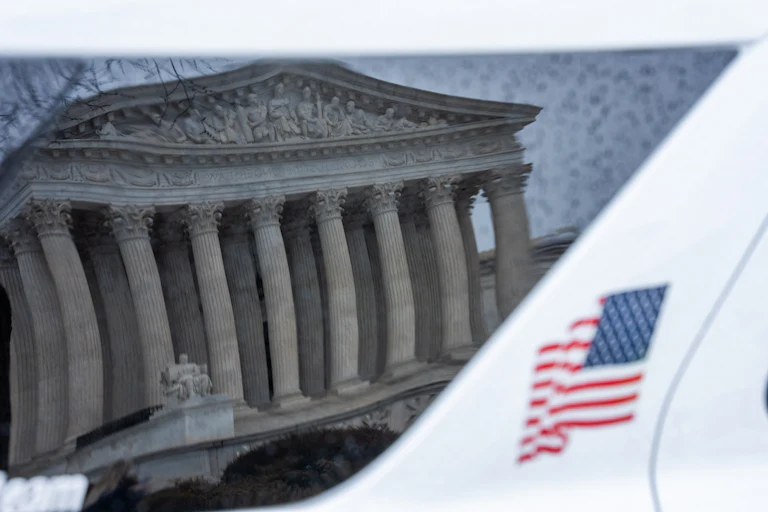 WASHINGTON, DC - FEBRUARY 20: The US Supreme Court as seen through a car's reflection on February 20, 2026 in Washington, DC. The Supreme Court struck down the legality of President Trump's tariffs in a 6-3 ruling.
