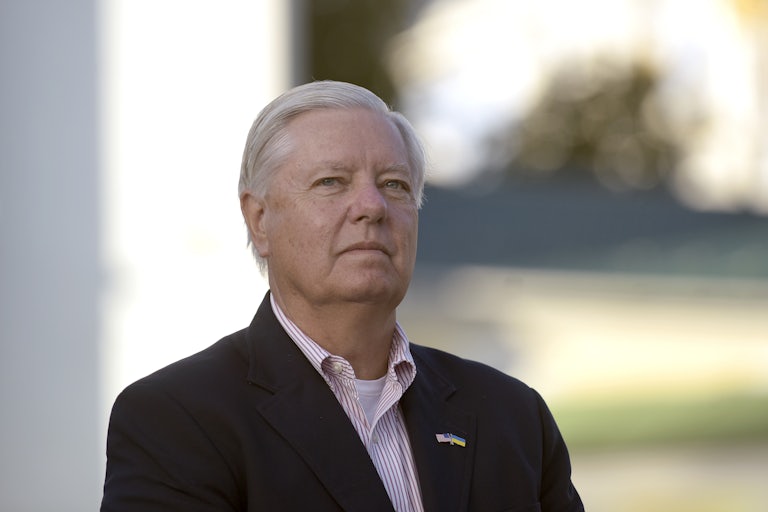 Lindsey Graham looks at reporters during a press conference