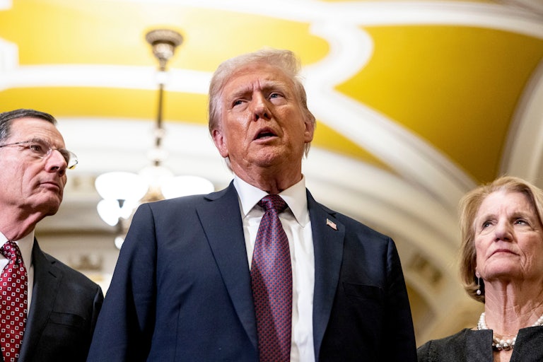 Donald Trump speaks to reporters in the Capitol