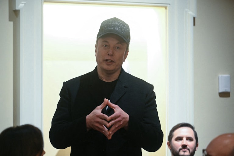 Elon Musk presses his fingertips together while speaking during Donald Trump’s Cabinet meeting