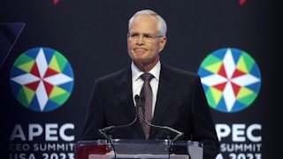 Darren Woods stands at a lectern.